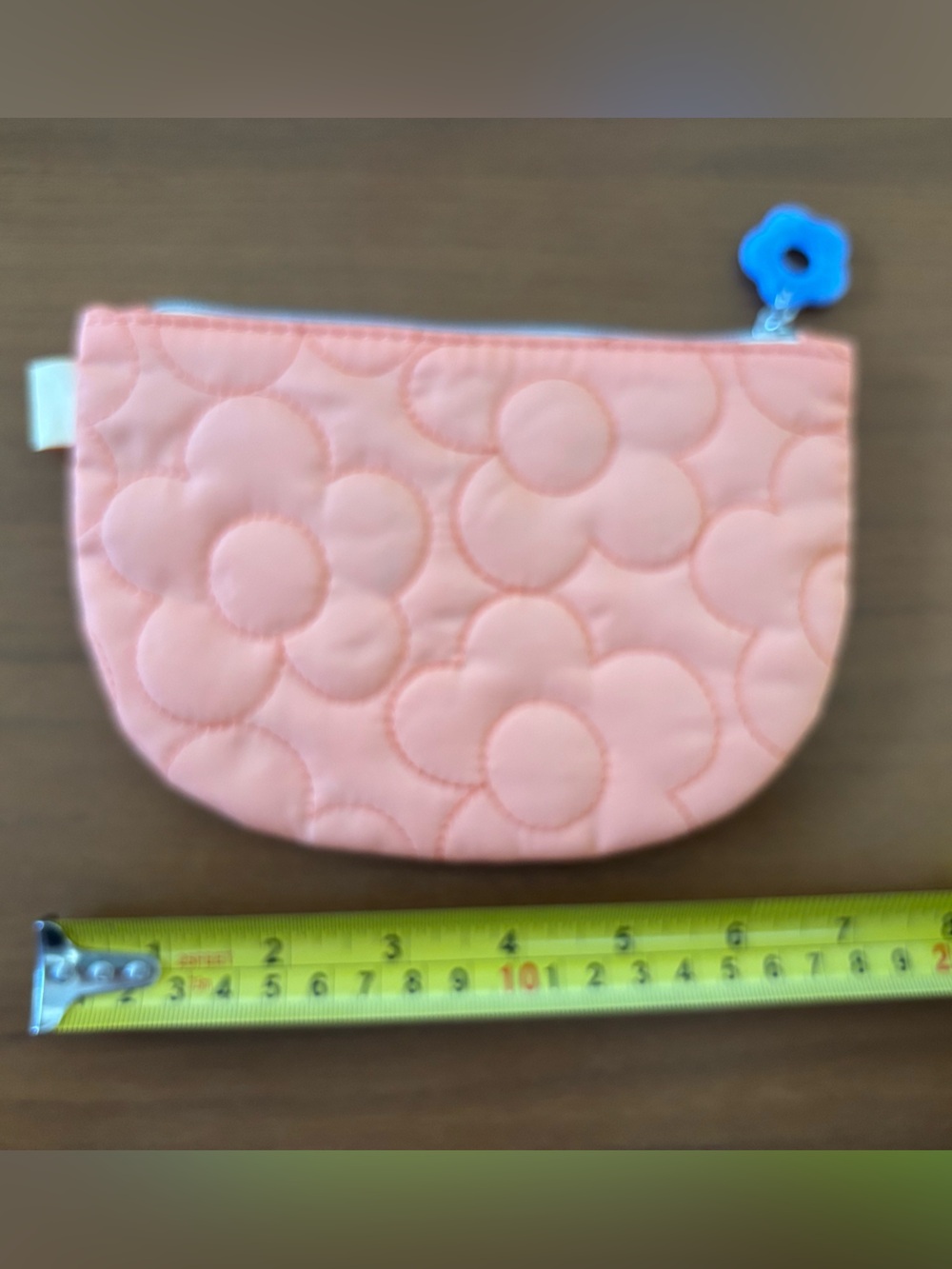 Ipsy peach quilted makeup bag with blue daisy zipper pull April 2025